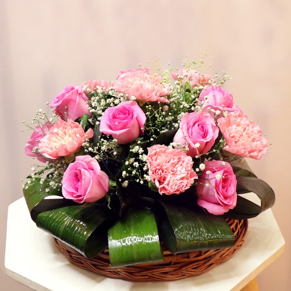 6 Pink Carnations with 6 Pink Roses arranged in a Basket