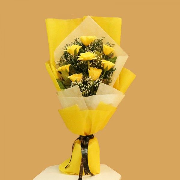  8 Yellow Roses in Paper Packing