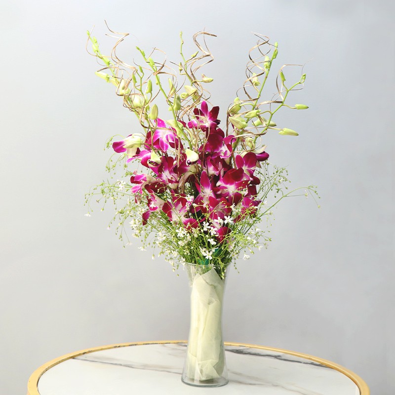  6 Purple Orchids with Arica Palm Leaves in a Glass Vase