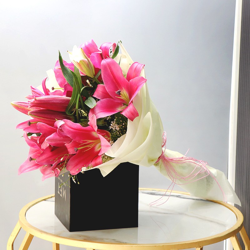 5 Asiatic Pink Lilies wrapped in cellophane paper
