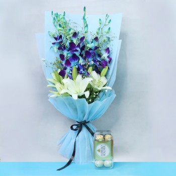 4 Blue Orchids and 4 Yellow and White Asiatic Lilies in Yellow Paper and Blue Bow with 16 pcs Ferrero Rocher